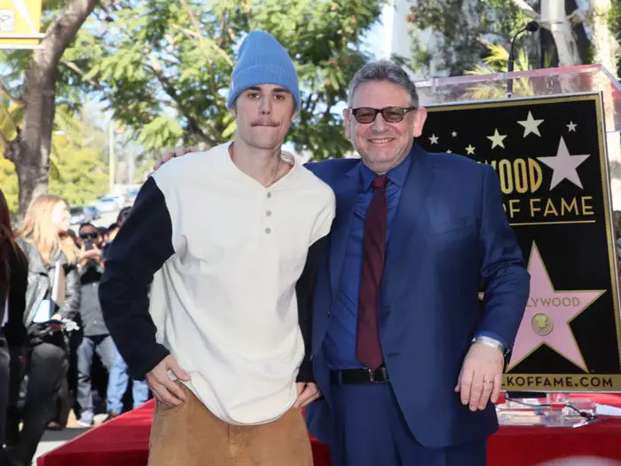 Justin Bieber (L) and Sir Lucian Grainge pose at an event honoring Sir Lucian Grainge with a star on the Hollywood Walk of Fame on January 23, 2020 in Hollywood, California.