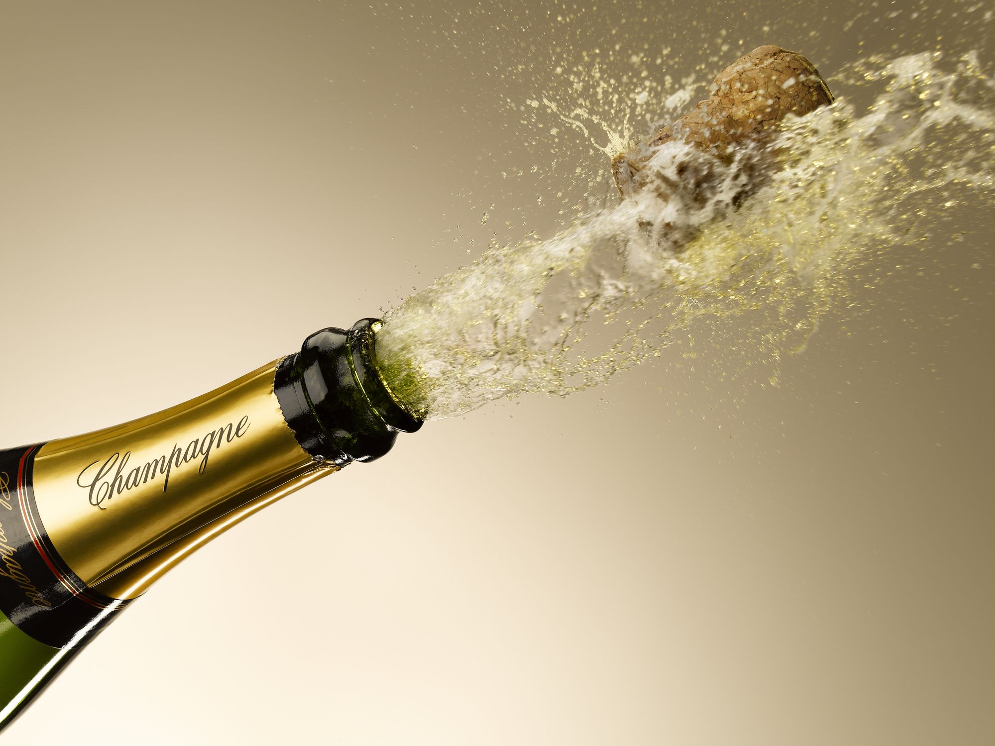 champagne-and-cork-exploding-from-bottle-royalty-free-image-1654271963.jpg