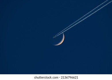 crescent-moon-airplane-contrail-260nw-2136796621.jpg