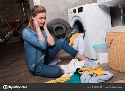 depositphotos_181420186-stock-photo-housewife-looking-pile-clothing-washing.jpg