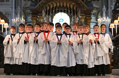 A choir of boys rehearses inside a cathedral.