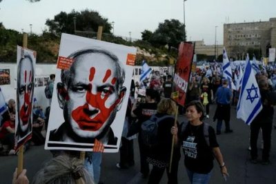 People take part in a protest against Israeli Prime Minister Benjamin Netanyahu's government in Jerusalem, Sunday.