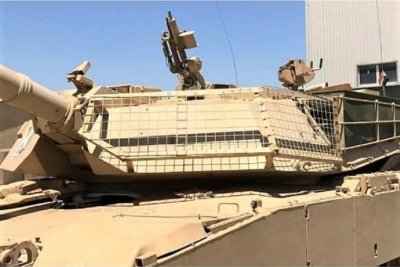 Wire mesh screens on the left side of the turret of Iraqi M1A1 Abrams :  r/TankPorn