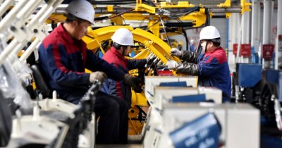 Employees work on a drilling machine production line at a factory in Zhangjiakou, Hebei province, China November 14, 2018. REUTERS/Stringer/File Photo
