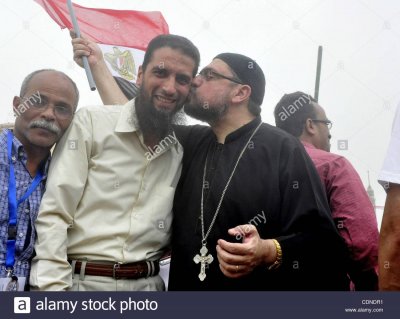 may-27-2011-cairo-egypt-an-egyptian-christian-protester-hugs-a-muslim-CDNDR1.jpg