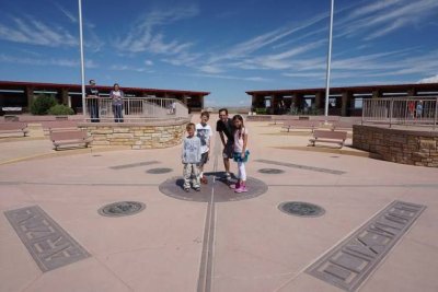 Four-Corners-marker-Utah-Nevada-New-Mexico-Arizona-family-Carltonauts-Travel-Tips.jpg