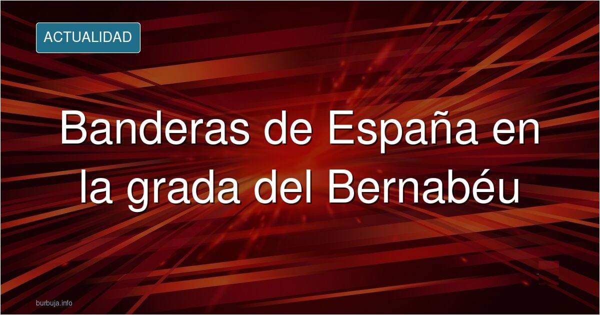Banderas de España en la grada de animación del Santiago Bernabéu