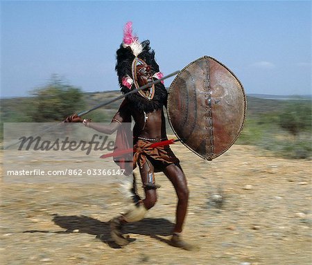862-03366147em-A-Maasai-warrior-in-full-battle.jpg
