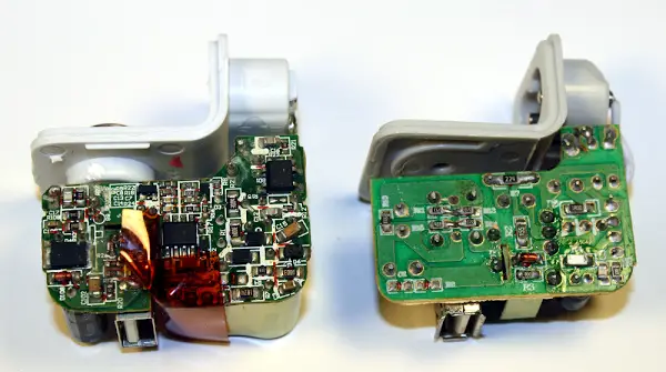 The circuit board of a real iPad charger (left) and a counterfeit charger (right).